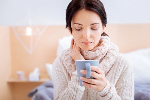 Woman bundled up with a mug in hand